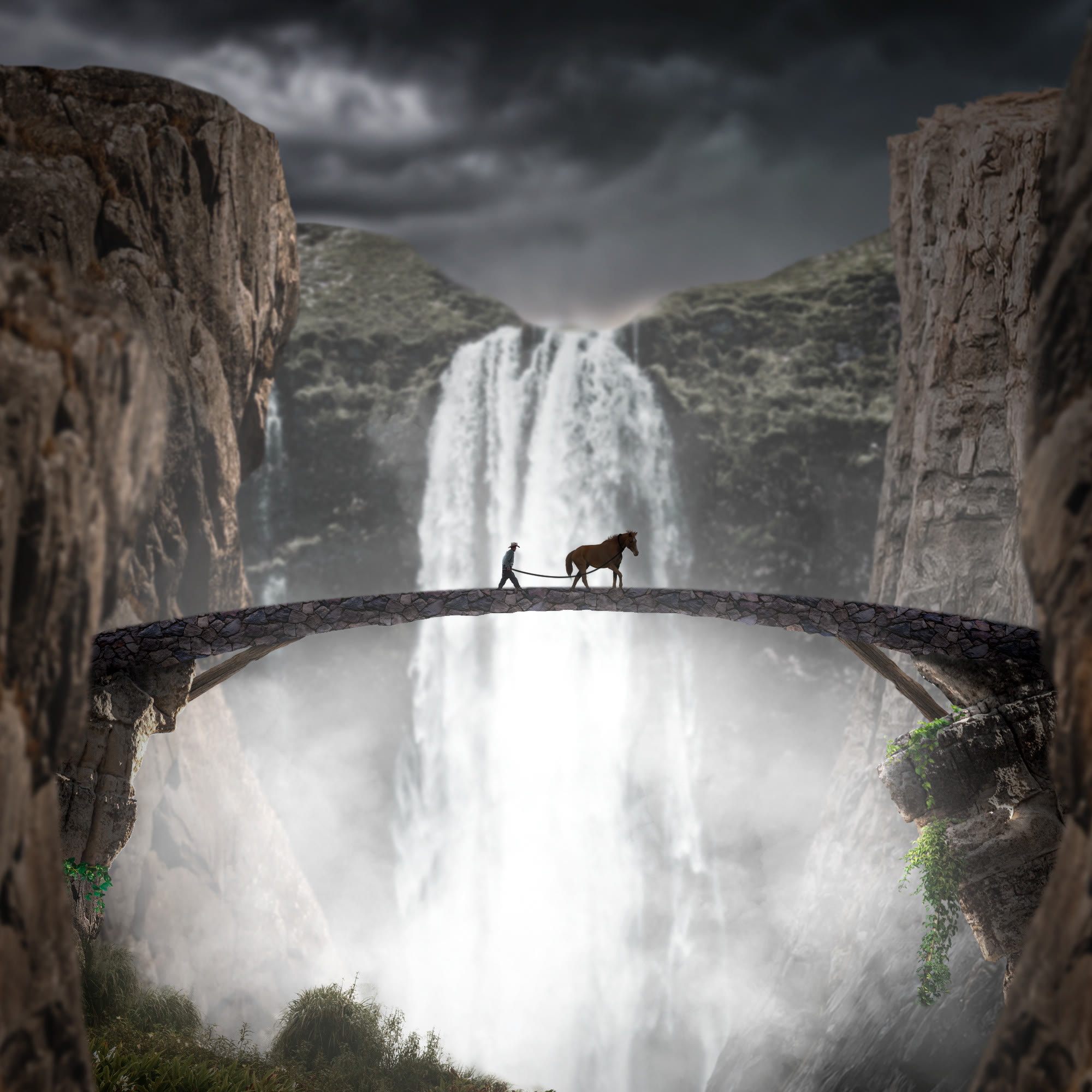 A man leading a horse across a stone bridge in front of a waterfall