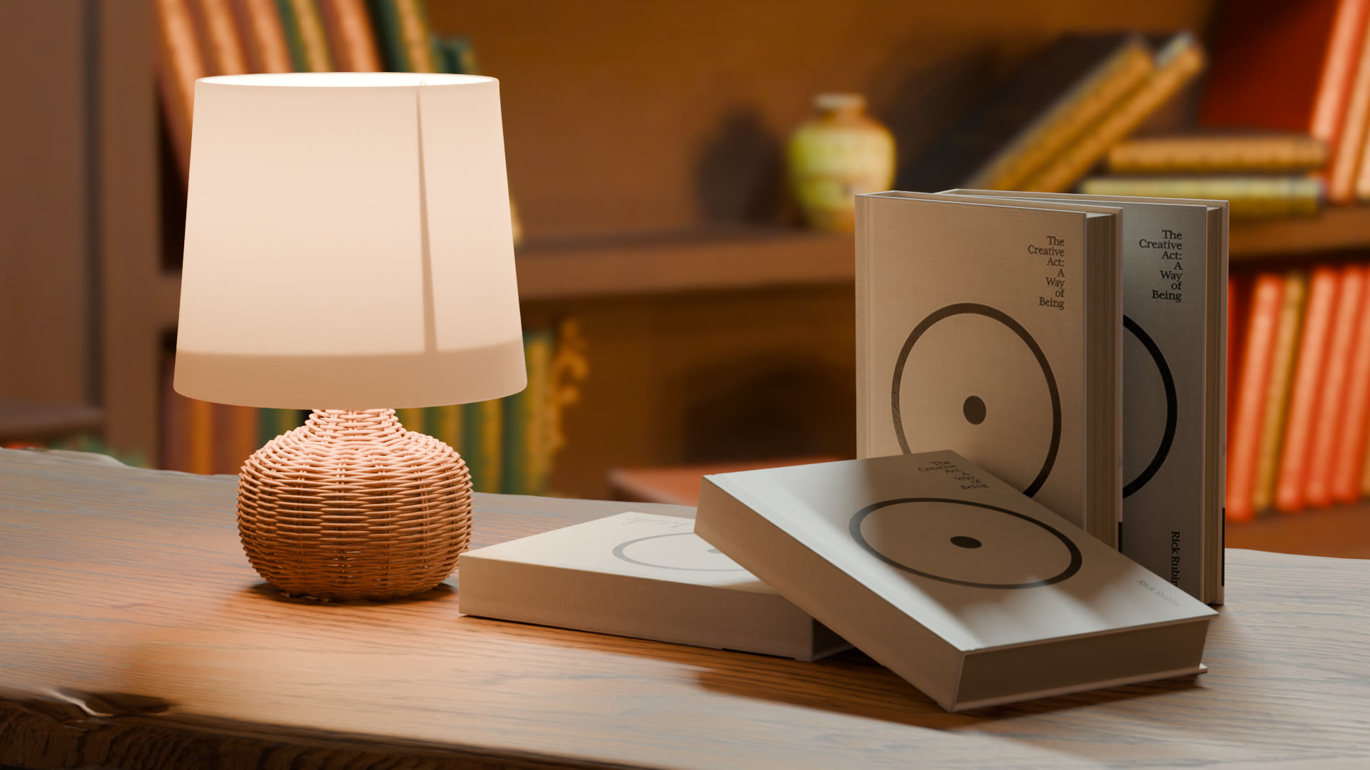 Two hardcover books with a circle design beside a wicker lamp, with a bookshelf behind